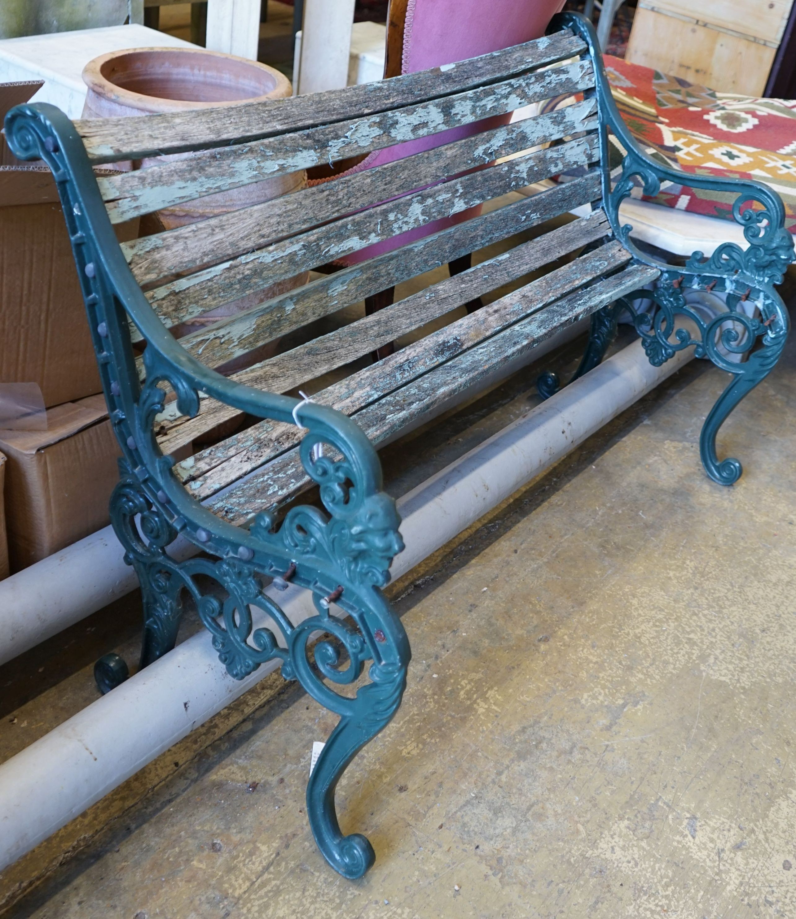 A painted aluminium slatted garden bench, in need of restoration, width 125cm